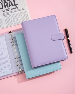 Macro detail of A5 6-ring binder showing textured PU leather cover and inner pocket
