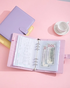 Close-up of pastel PU leather budget binder with 6-ring metal binder and zipper pouches