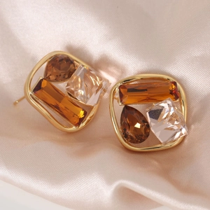 Elegant s925 silver needle geometric crystal stud earrings on champagne silk fabric