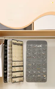 Detail view of double-sided 80-grid jewelry hanging organizer with transparent PVC pockets