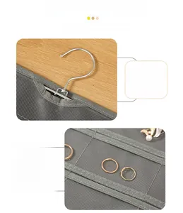 Detail of grey jewelry organizer with durable stainless steel hook and reinforced stitching