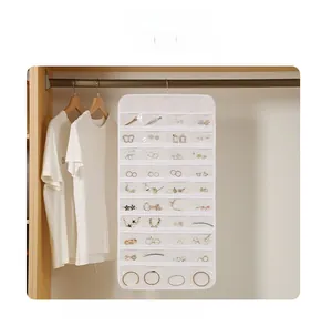 Hanging jewelry organizer with 32 clear pockets for earrings and hair clips