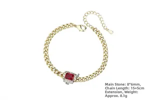 Detailed view of gold Cuban chain bracelet with 8x6mm rectangle red ruby and pave zircon