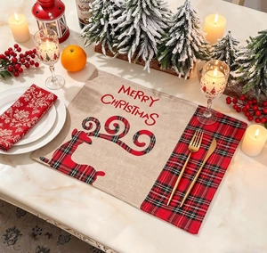 Detailed view of burlap Christmas placemat featuring red plaid reindeer and Merry Christmas text
