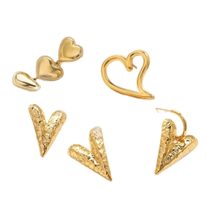 Three gold heart earrings with polished mirror and hammered metal texture on white background