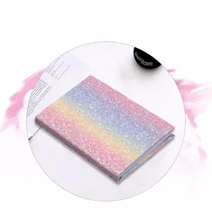 Detail of pink and purple gradient sequin glitter cover on a hardcover notebook