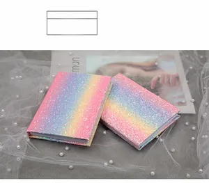 Close-up of sparkling rainbow sequin notebook covers with shimmering gradient texture