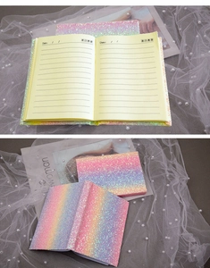 Detailed view of rainbow glitter notebook with lined inner pages and date sections