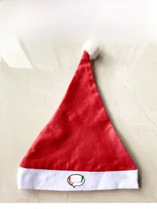 Detailed view of red plush Christmas hat with white brim and custom Orale bubble logo
