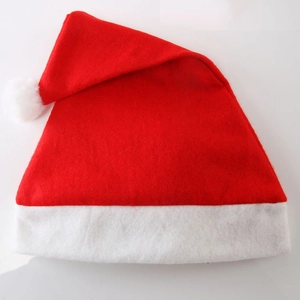 Classic red Christmas Santa hat with white plush trim and pompom on white background