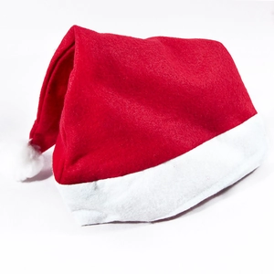 Close-up of the non-woven fabric texture on a classic red and white Christmas hat