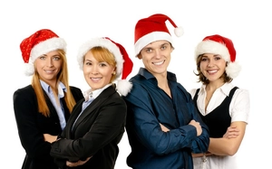 Group wearing sequined and classic plush Santa hats for office holiday party decorations
