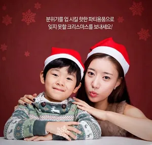 Classic red and white Santa hats worn by a woman and child in a festive holiday setting