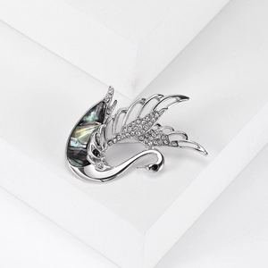 Elegant silver swan brooch with iridescent abalone shell and micro-pave crystals on wings