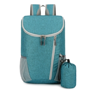 Teal lightweight waterproof folding travel backpack with a compact storage pouch