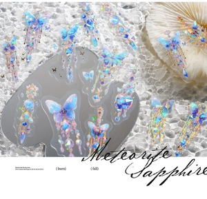Detail of laser iridescent PET stickers featuring butterflies and sapphire jewelry themes