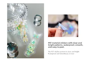 Close-up of waterproof PET sticker with holographic laser lily and butterfly designs