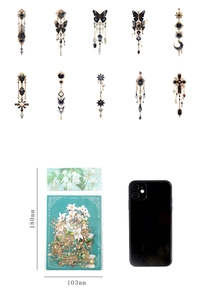 Macro detail of gothic PET stickers showing gold foil butterfly and star motifs