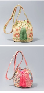 Detail of bohemian hand-woven bucket bags with floral patterns and colorful tassels