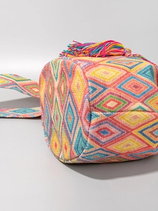 Bohemian woven canvas bucket bag with colorful geometric patterns and large tassels