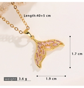 Detail showing mermaid tail pendant dimensions and pink crystal inlay on gold chain