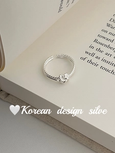 Close-up of S925 sterling silver twist ring with knot detail and adjustable opening