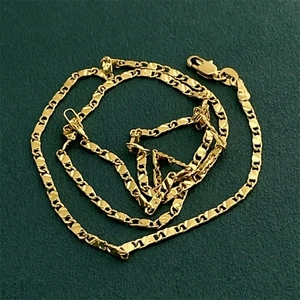 Close-up of flat 18K gold-plated 2mm chain link necklace with lobster clasp detail