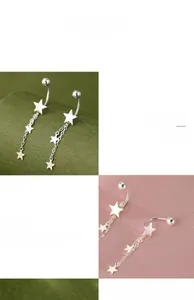 Macro detail of S925 sterling silver star fringe earrings with polished mirror finish