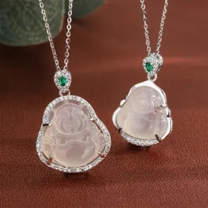 Macro shot of two lavender chalcedony Buddha pendants with crystal halo on silver chain