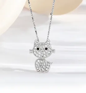 Close-up of S925 silver kitten pendant featuring pave-set white and black cubic zirconia