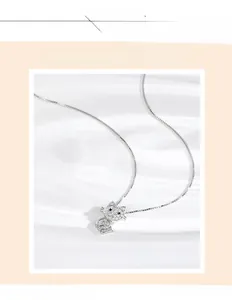 Detailed macro view of S925 silver cat pendant with sparkling pave crystals and box chain