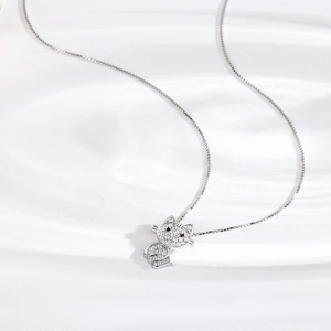 Elegant S925 sterling silver kitten necklace with sparkling white zircons on a wavy tray