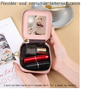 Pink quilted lipstick case with built-in mirror and gold keychain detail