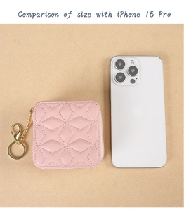 Pink quilted lipstick case with gold keychain compared to iPhone 15 Pro for size reference