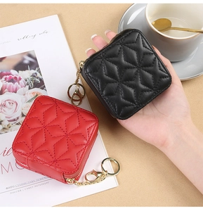 Detailed close-up of quilted star pattern on mini lipstick bags with golden hardware