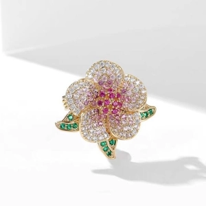 Elegant gold flower ring with pink gradient zircon petals and green leaves