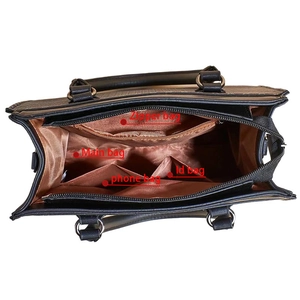 Detailed interior view of a black tote bag showing a main section and functional pockets