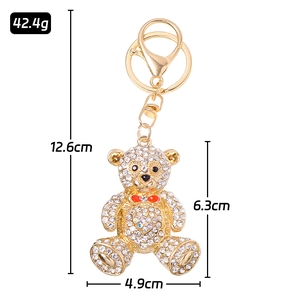 Crystal rhinestone bear keychain with red bow and gold metal base 12.6cm total length