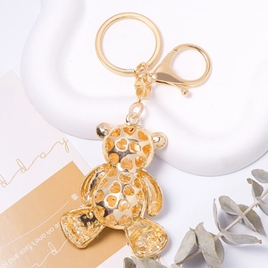 Golden rhinestone teddy bear keychain with heart cutout and luxury lobster clasp charm