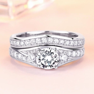 Close-up of S925 silver stacked rings with square zircon inlay and brilliant pavé details