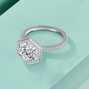 Macro view of a hexagonal halo sterling silver ring with a round brilliant moissanite stone