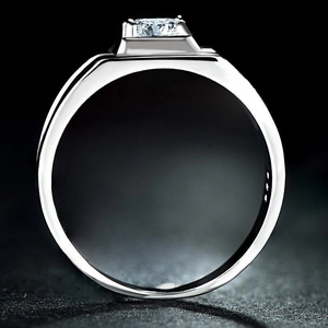 Detail of S925 sterling silver men ring with square cut cubic zirconia on black texture