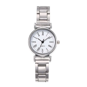 Detailed macro view of retro silver quartz watch featuring classic Roman numeral dial
