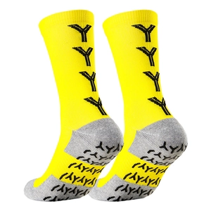 Detail showing bright yellow athletic crew socks with grippy Y-pattern and grey heel accents