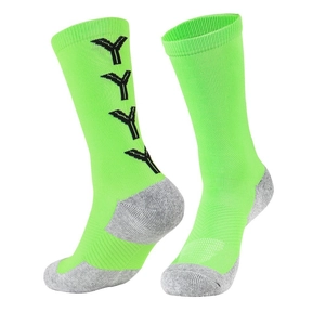 Close-up of neon green mid-calf soccer socks with reinforced grey heel and black graphics