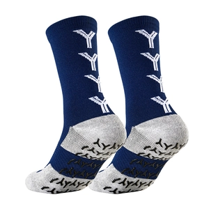 Macro detail of navy athletic socks featuring non-slip silicone grips and towel bottom