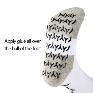 White and grey soccer socks with non-slip grip dots on the sole for better traction