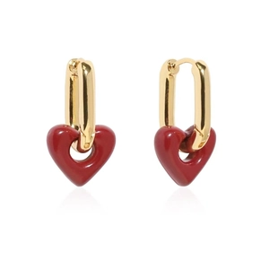 Macro detail of red heart pendant earrings with gold U-shaped hoops and glossy finish