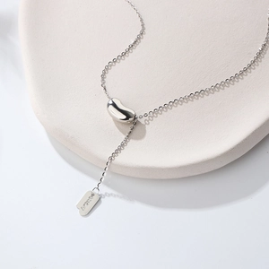 925 Sterling silver lucky bean necklace with polished finish and Lucky engraved tag