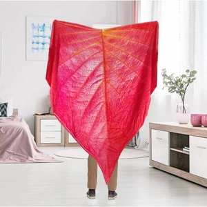 Close-up of red leaf-shaped flannel blanket with 3D leaf vein pattern and soft texture